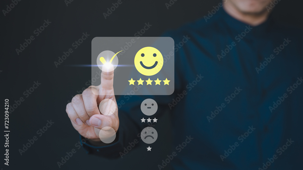 Aufkleber customer hand touching the virtual screen on happy smile face icon to give satisfaction in service. 