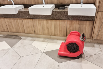Floor dryer fan used in public washroom and toilet to dry the floor after washing and cleaning