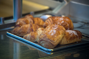 Fototapeta premium Closeup of traditional french croissants in a bakery showroom
