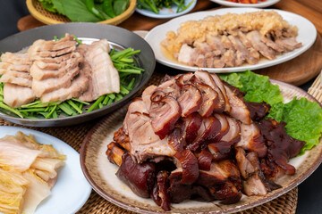 Korean food, bossam, boiled pork, pig feet, steamed pork feet, side dishes, lettuce, garlic bossam, perilla leaves, chives, kimchi