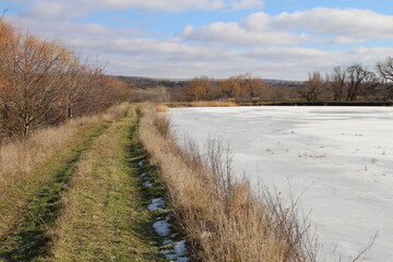 A river with a trail of snow