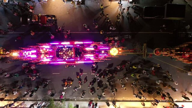 Chak Phra Festival (Pulling the Buddha) in Southern Thailand.  Chak Phra takes place in the eleventh lunar month of the traditional (in Thai lunar calendar).
