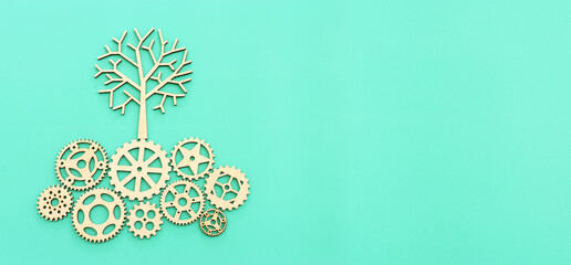 image of spinning gears leading to a growing tree. Concept of creativity, education and technology