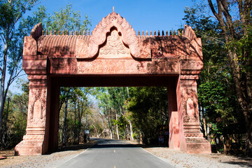 Ancient art entrance gate for thai people travelers journey pass travel visit respect praying blessing wish worship buddha on mountain at Phanom Sawai Forest Park on January 5, 2024 in Surin, Thailand