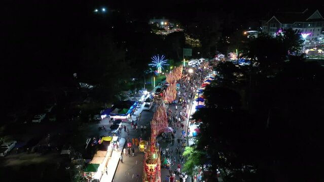 Chak Phra Festival (Pulling the Buddha) in Southern Thailand.  Chak Phra takes place in the eleventh lunar month of the traditional (in Thai lunar calendar).