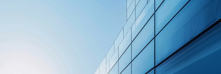 Fototapeta na wymiar Modern Glass Facade Office Building with Blue Sky Reflection