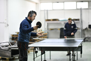 industry workers table tennis game and relaxing in their free time