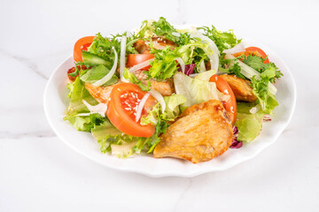 Weight loss, Healthy lifestyle, diet food, sport and fitness concept. Fresh balanced vegetable and chicken breast salad with fruit, fitness equipment, dumbbell, measuring tape on a white background