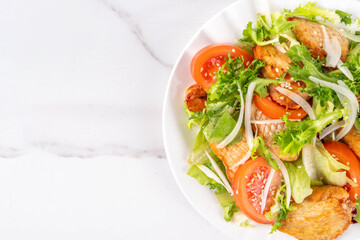 Weight loss, Healthy lifestyle, diet food, sport and fitness concept. Fresh balanced vegetable and chicken breast salad with fruit, fitness equipment, dumbbell, measuring tape on a white background
