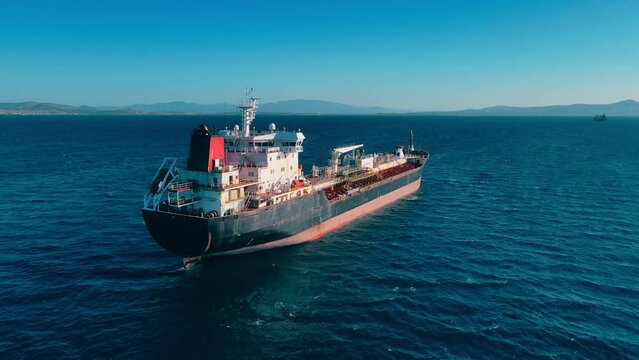 Oil products tanker cargo ship waiting loading petrochemical terminal. Aerial view