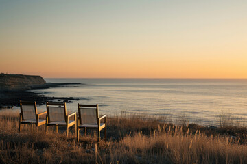 Fototapeta na wymiar Chairs strategically placed along the coast, inviting conversations with the sea
