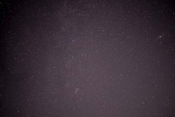 Meteor shower during perseid curent. Andromeda galaxy in the night sky