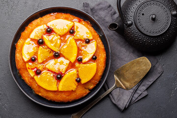 Sweet cake with orange slices and berries