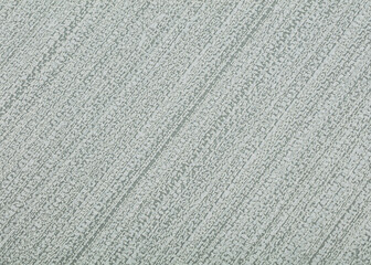 Background of gray paper wallpaper with straight textured lines.