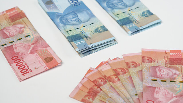 photo of Indonesian rupiah banknotes. financial management concept, on a white background