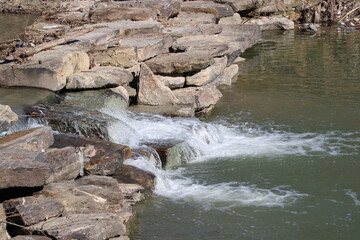 A waterfall on an Urban Stream in a retail residential development has now sprung another park along its opposite banks