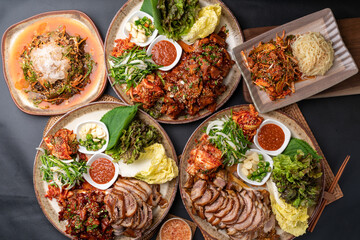 Steamed pork feet, jokbal, spicy pork feet, sea snail, seasoned spicy fish, tray noodles, Korean...