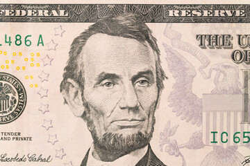 US President Abraham Abe Lincoln on USA five dollar bill macro, 5 usd