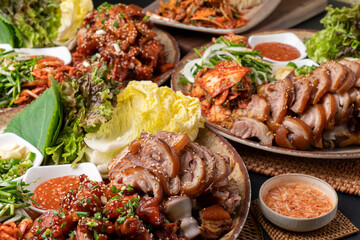 Steamed pork feet, jokbal, spicy pork feet, sea snail, seasoned spicy fish, tray noodles, Korean food, traditional food, pork