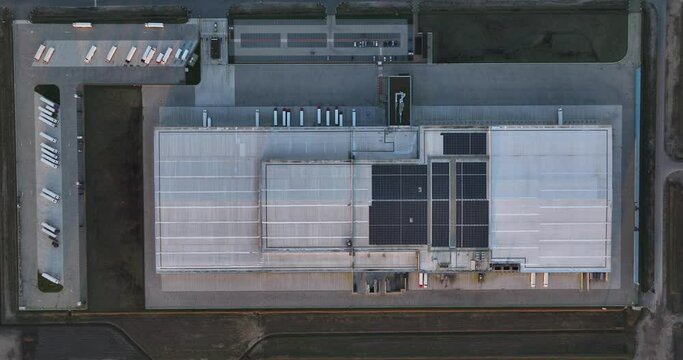 Top down view on distribution warehouse in Almere, The Netherlands. Transportation logistics over the road.