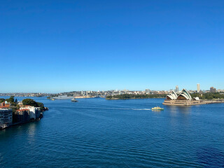 View of Sydney bay, Australia. Panorama of the city's coastline from the ocean. Sydney Opera House...