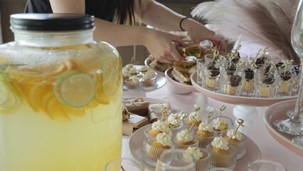 Buffet and snacks at a business event. Beautiful table setting in a restaurant. Preparation for the holiday, table setting by the waiter. Snacks on the table, catering concept.
