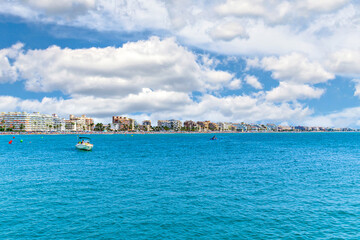 Views of Peñiscola beach from its famous castle on a sunny day with white clouds. Castellon, Valencian Community, Spain