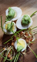quail eggs on  wheatgrass with wasabi