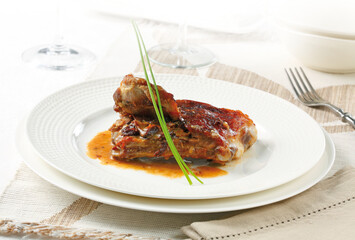 grilled lamb rib served with its sauce