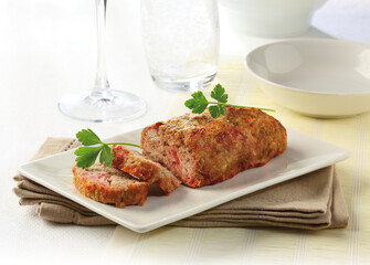 Delicious baked beef meat pie, served on a plate on a table.