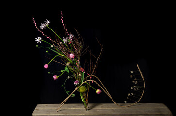 abstract floral art in the shape of an insect with a tail