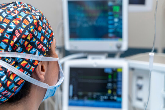 anesthetist monitor screen with vital sign and ECG data of patient during surgery inside operating room in hospital. Monitor people under anesthesia. showing patient heart rate and blood pressure