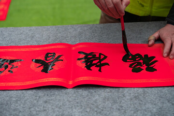 writing Chinese new year scrolls translation of the characters are greet the new year and encounter...