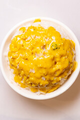 top view bowl of rice with curry on top at vertical composition