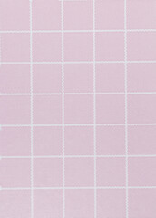 Pastel pink paper with white stripes and squares as a background.