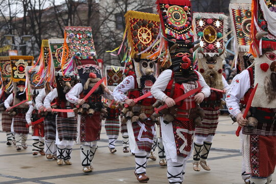 Pernik, Bulgaria - January 27, 2024: The 30th International masquerade festival Surva in Pernik, Bulgaria. People with mask called Kukeri dance and perform to scare the evil spirits.
