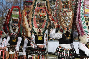 Pernik, Bulgaria - January 27, 2024: The 30th International masquerade festival Surva in Pernik, Bulgaria. People with mask called Kukeri dance and perform to scare the evil spirits.