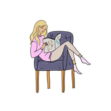 Beautiful woman sitting and reading a magazine.
