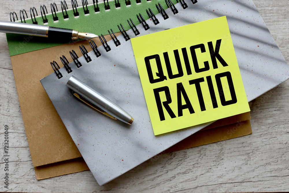 Poster quick ratio gray notepad on the table. text on page