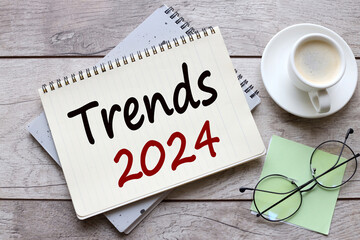 trends 2024 cup of coffee near glasses. text on page
