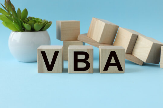 blue background. wooden cubes with text. VBA