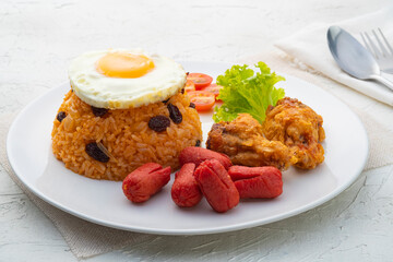 American style breakfast set,Fried rice with fried chicken ,sausage and vegetable on white plate