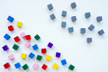 Gray cubes and multi-colored ones as a symbol of diversity.