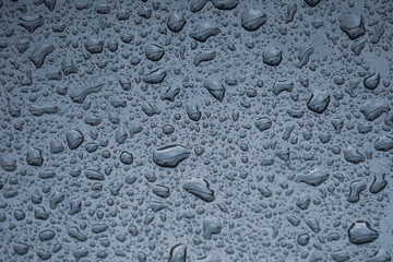  raindrops on the metallic surface in rainy days