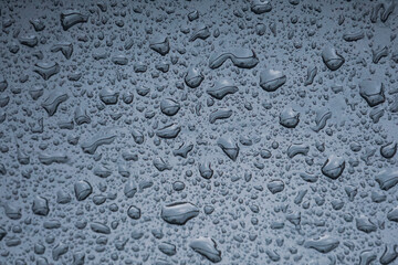  raindrops on the metallic surface in rainy days