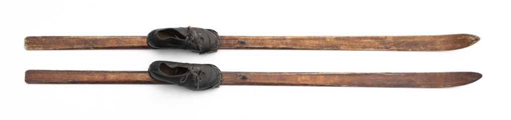 old wooden skis with boots isolated on white background