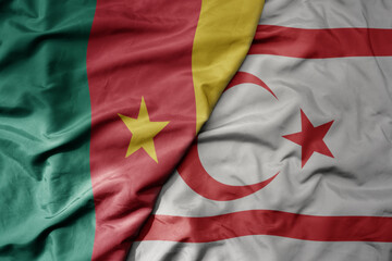 big waving national colorful flag of northern cyprus and national flag of cameroon .