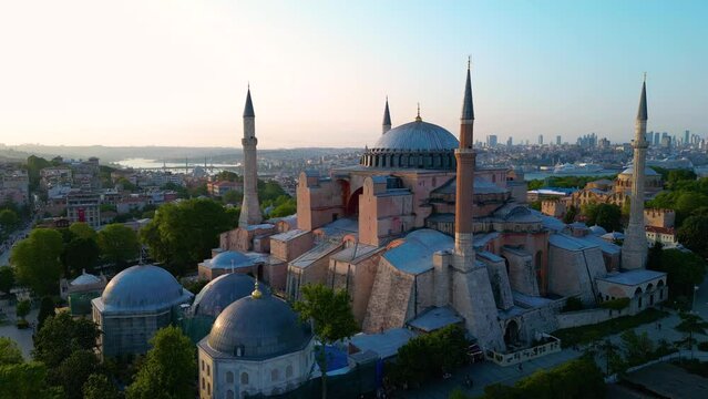 Hagia Sophia aerial view at sunset with Golden Horn at the background in Sultanahmet in historic city of Istanbul, Turkey. Historic Areas of Istanbul is a UNESCO World Heritage Site since 1985. 