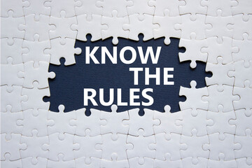 Know the rules symbol. Concept words Know the rules on white puzzle. Beautiful deep blue background. Business and Know the rules concept. Copy space.