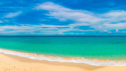 Fototapeta na wymiar Beautiful paradisiacal beach, with blue sky, clouds, and the sea